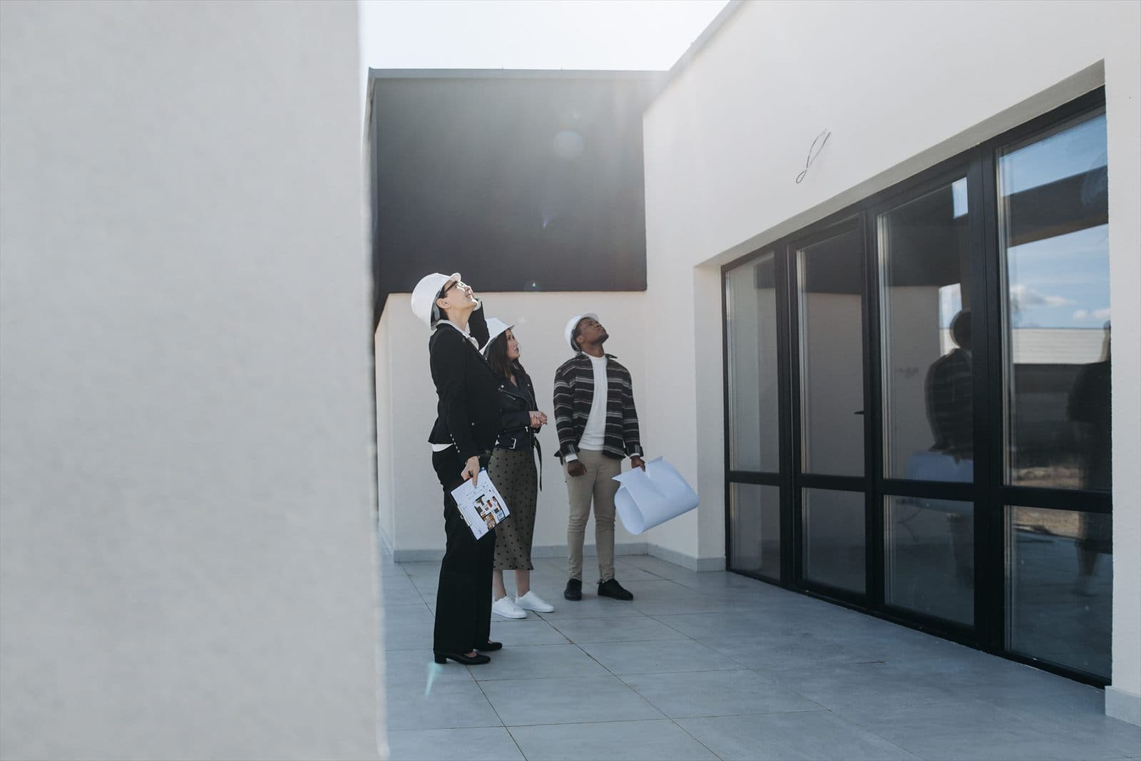 Property professionals inspecting a modern building